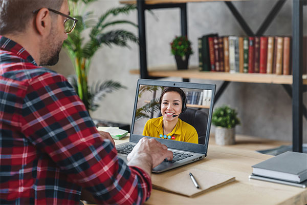 man coaching a student virtually